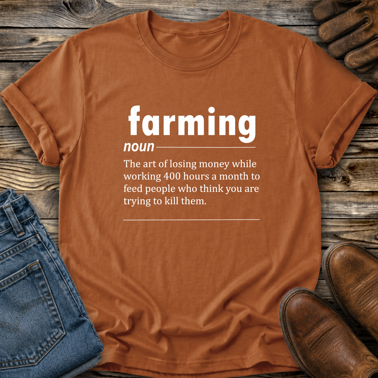 orange tshirt with a graphic of funny text that gives a definition of farming