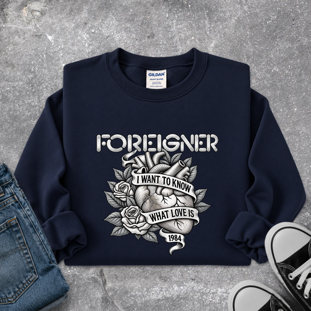 navy blue sweatshirt with a foreigner band graphic that says i want to know what love is