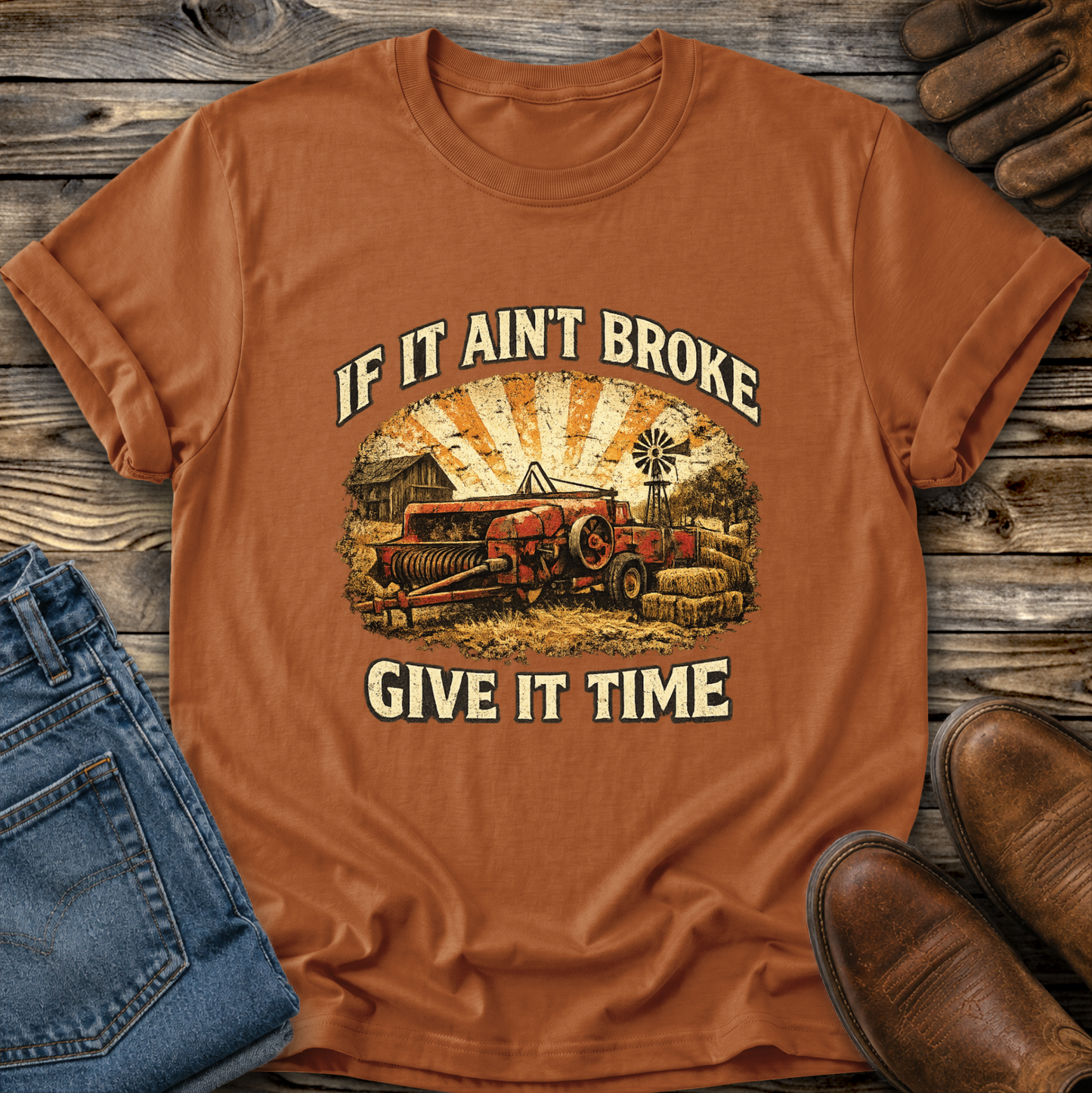 orange tshirt with farm machinery graphic that says if it aint broke give it time