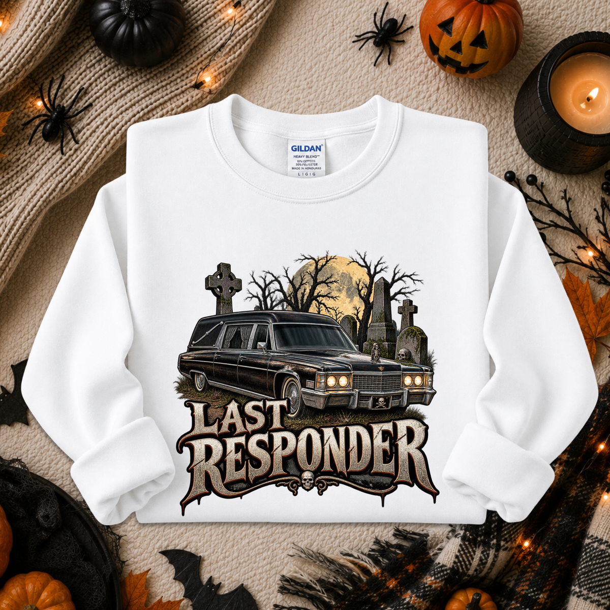 white sweatshirt with a graphic design of a cemetery and hearse and it says Last Responder