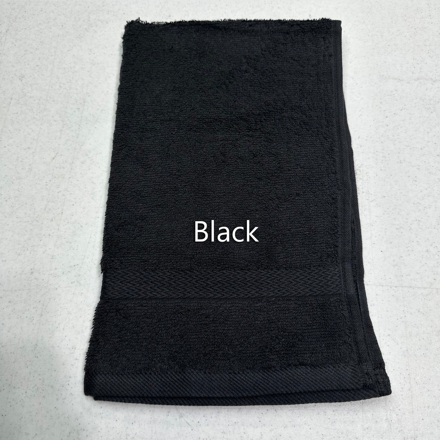 Black towel labeled 'Black' on a light gray background