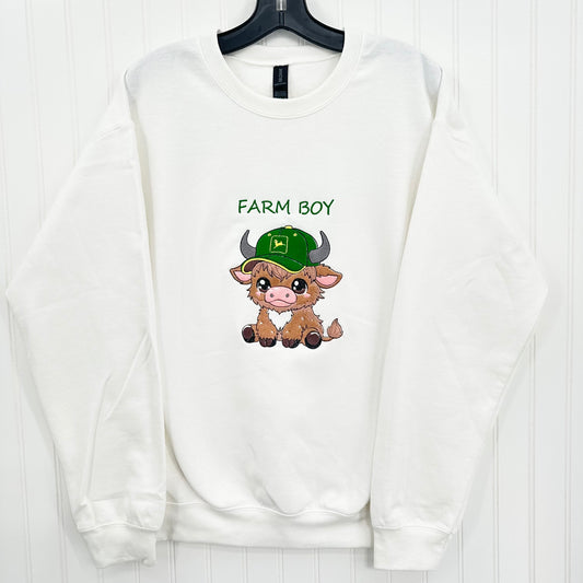 embroidered highland cow wearing a green hat on a white sweatshirt and says farm boy