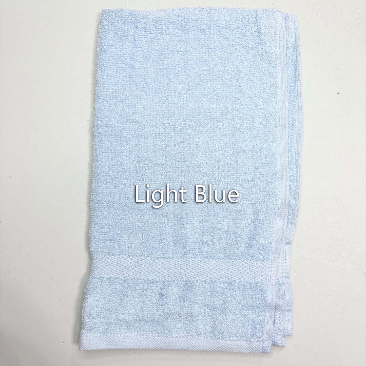 Light blue towel with 'Light Blue' text on a white background