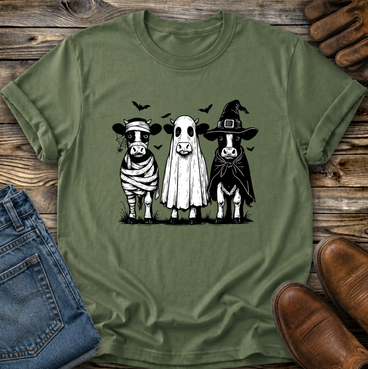 green tshirt with funny graphic of 3 cow dressed up in halloween costumes