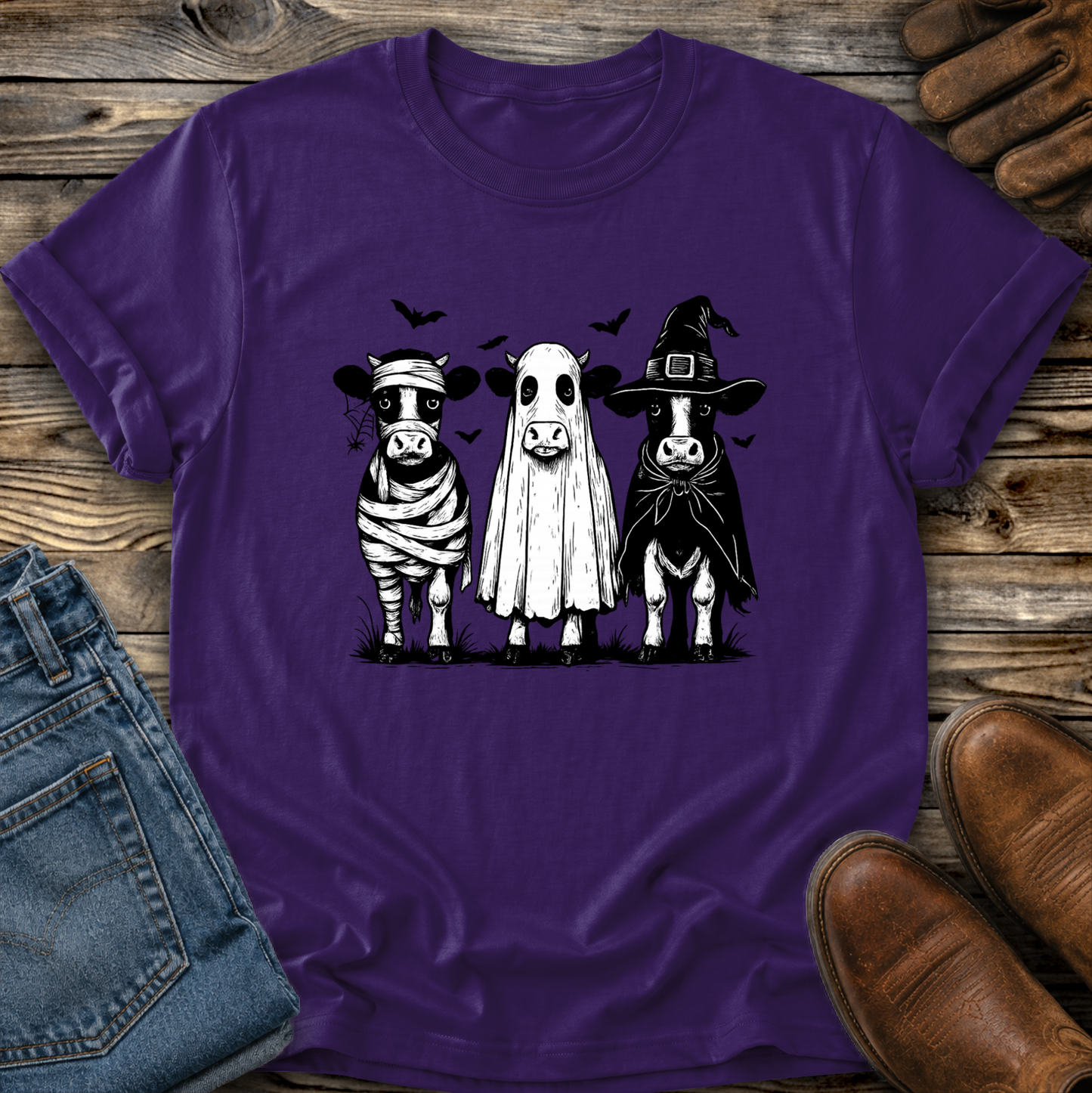 purple tshirt with funny graphic of 3 cow dressed up in halloween costumes