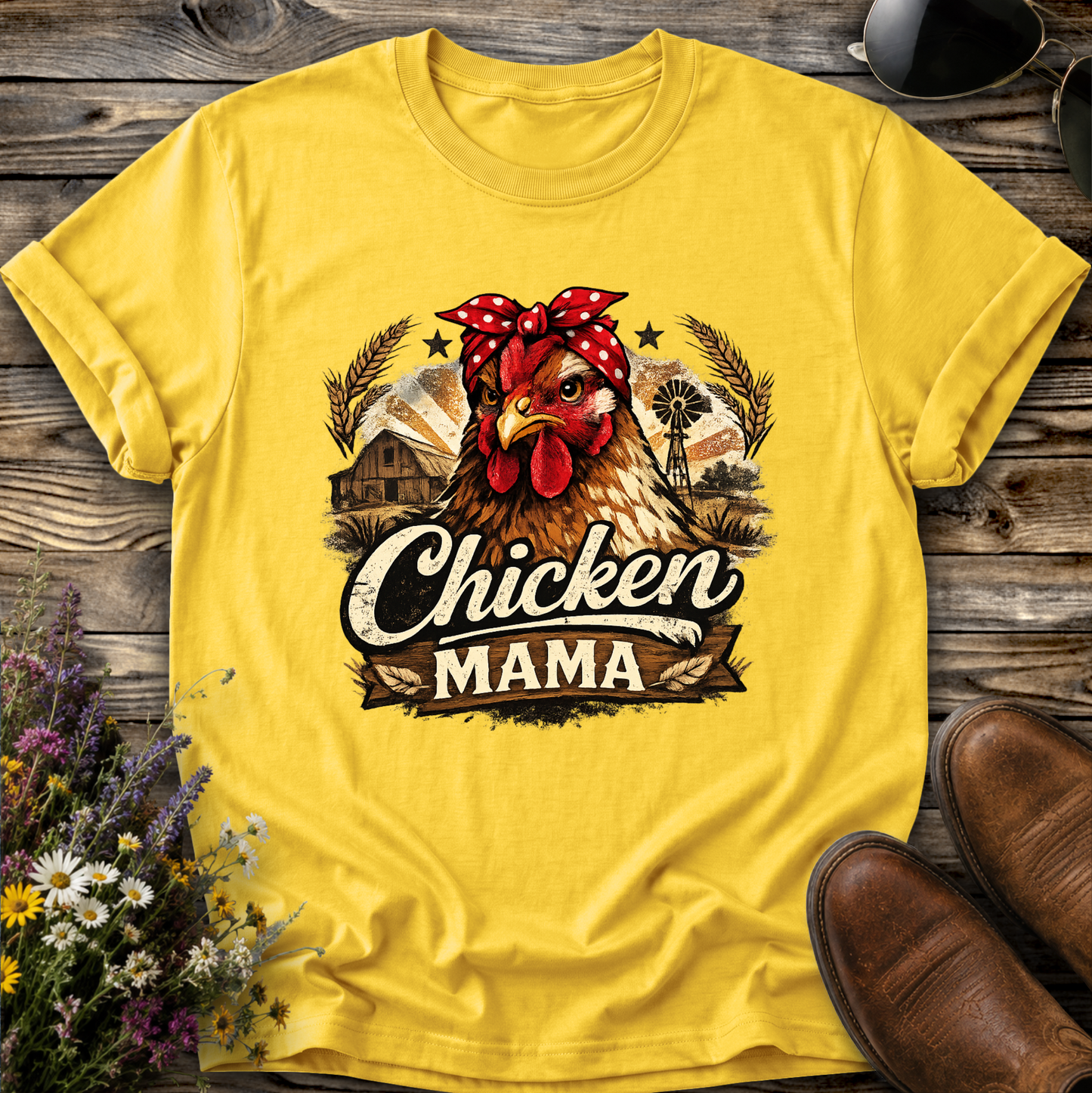 yellow tshirt with a country farm scene and  a chicken with a bandana on and it says chicken mama