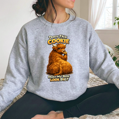 woman wearing a gray sweatshirt with funny highland cow graphic design that says does this cookie make my butt look big