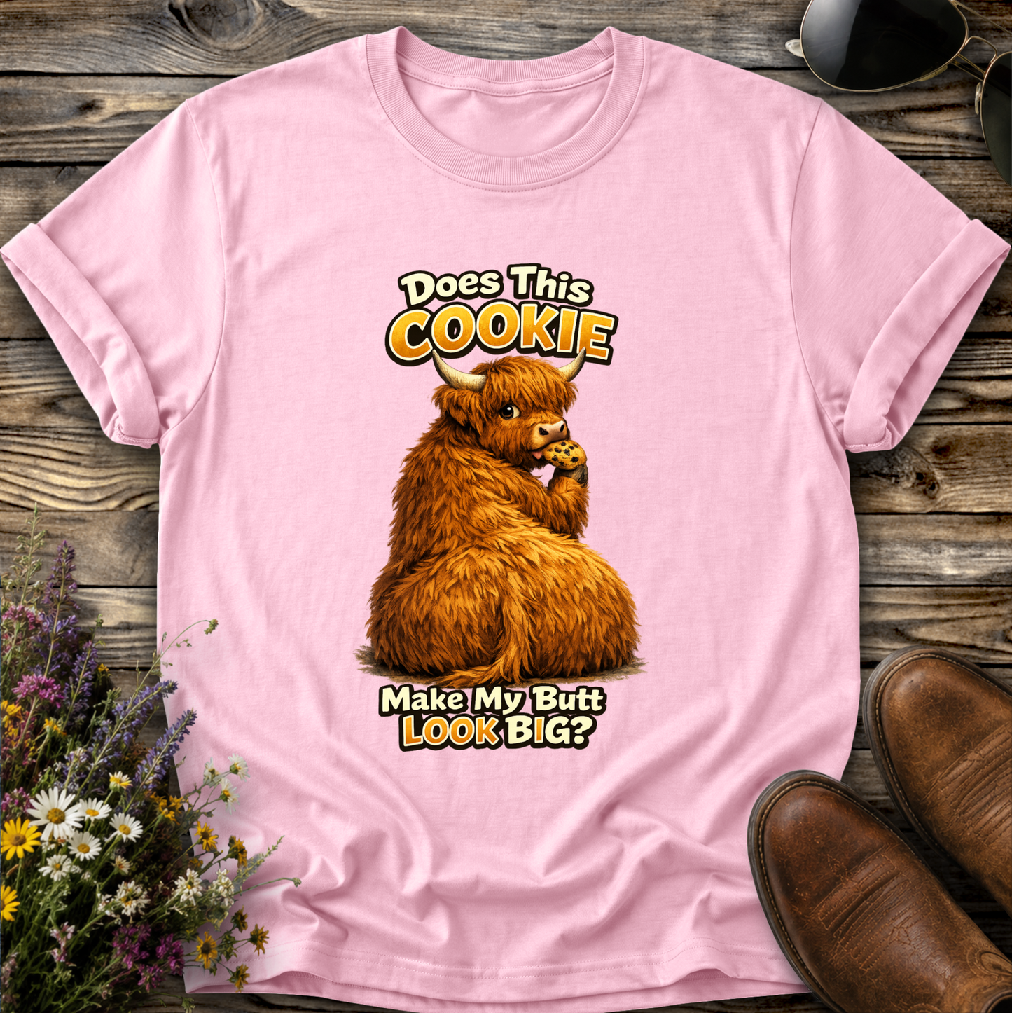 pink tshirt with funny highland cow graphic design that says does this cookie make my butt look big