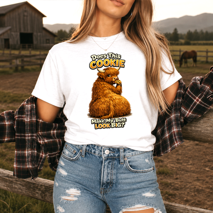 woman wearing white tshirt with funny highland cow graphic design that says does this cookie make my butt look big
