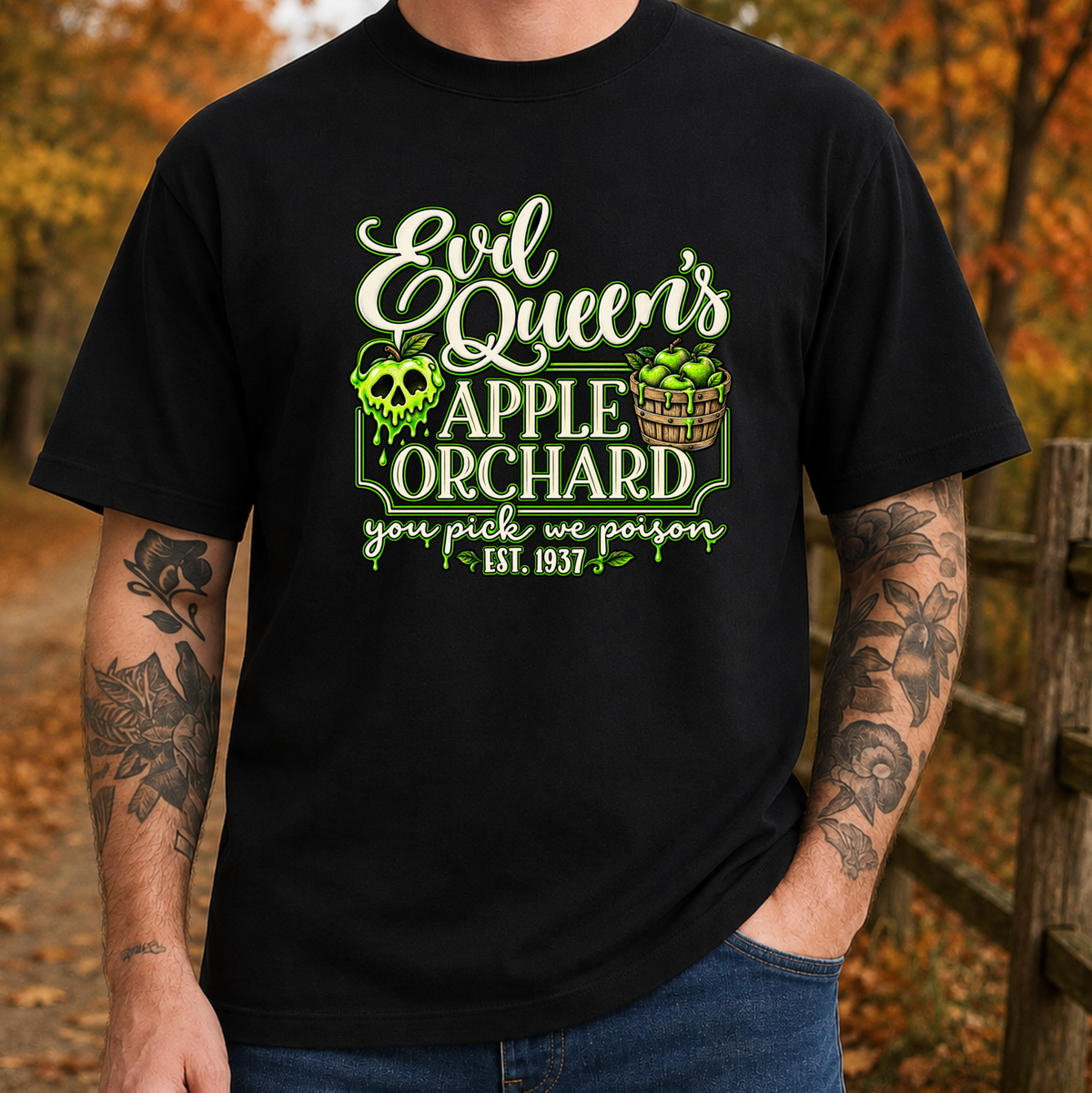 man wearing a black tshirt with a graphic design that says evil queen's apple orchard you pick we poison on it