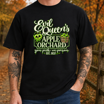 man wearing a black tshirt with a graphic design that says evil queen's apple orchard you pick we poison on it