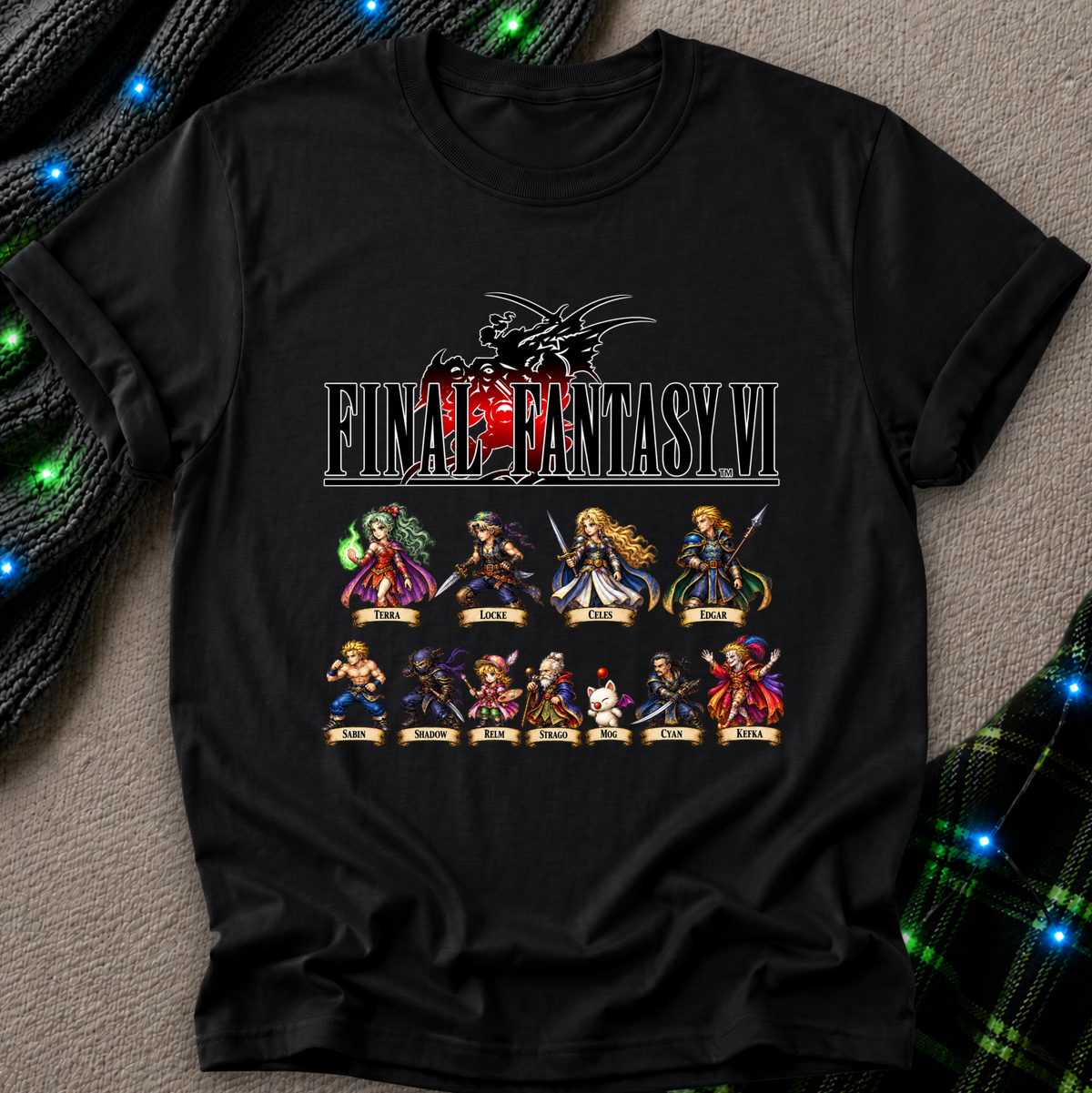 A black short-sleeve graphic T-shirt laid flat on a textured gray surface, featuring a large Final Fantasy VI character print on the front. The shirt is styled with dark green plaid fabric and glowing blue string lights around it.
