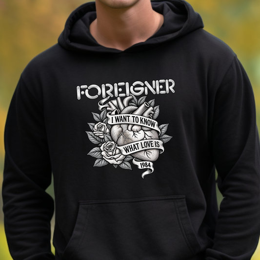 black hooded sweatshirt with a foreigner band graphic that says i want to know what love is