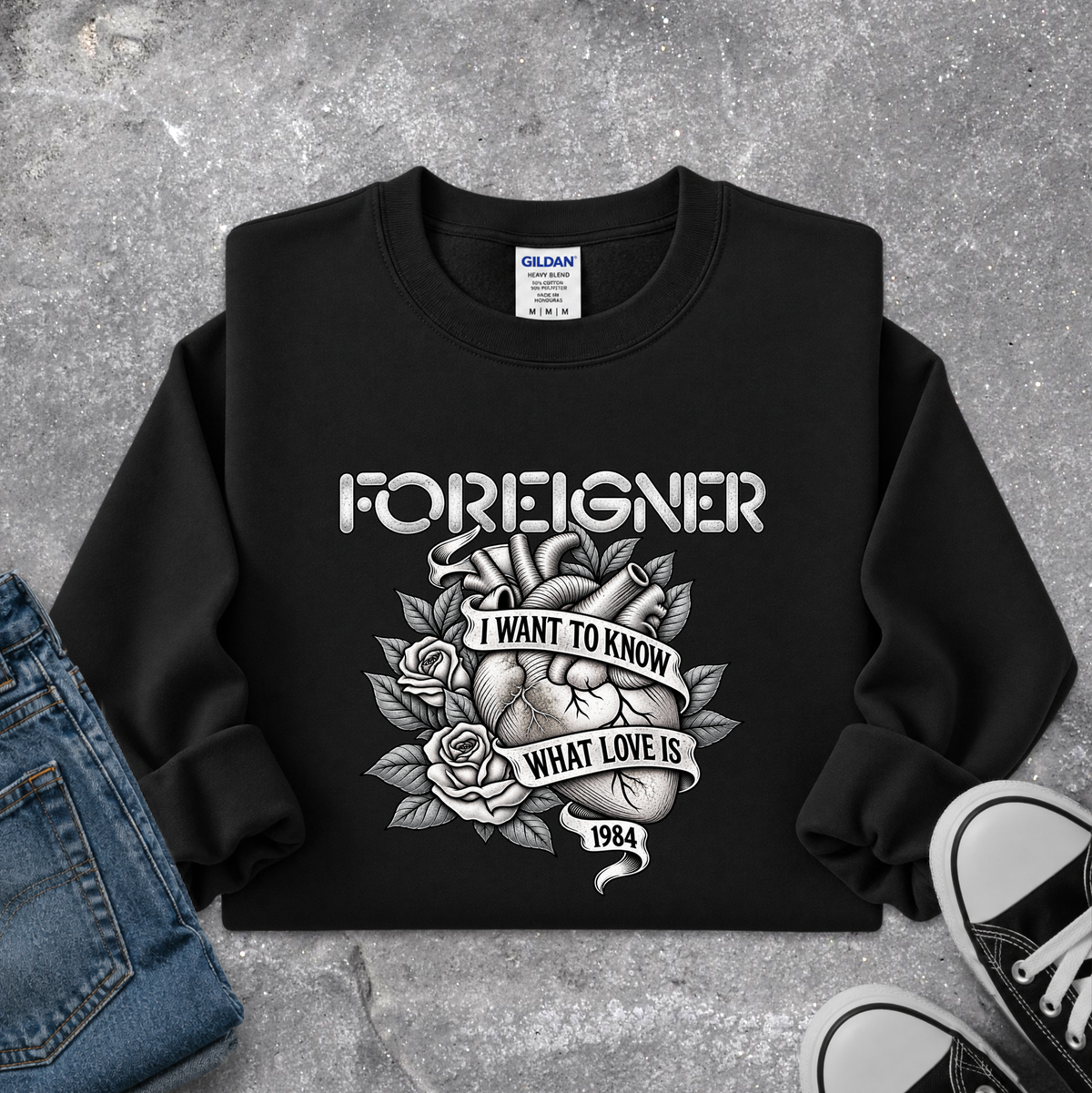 black sweatshirt with a foreigner band graphic that says i want to know what love is
