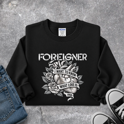 black sweatshirt with a foreigner band graphic that says i want to know what love is