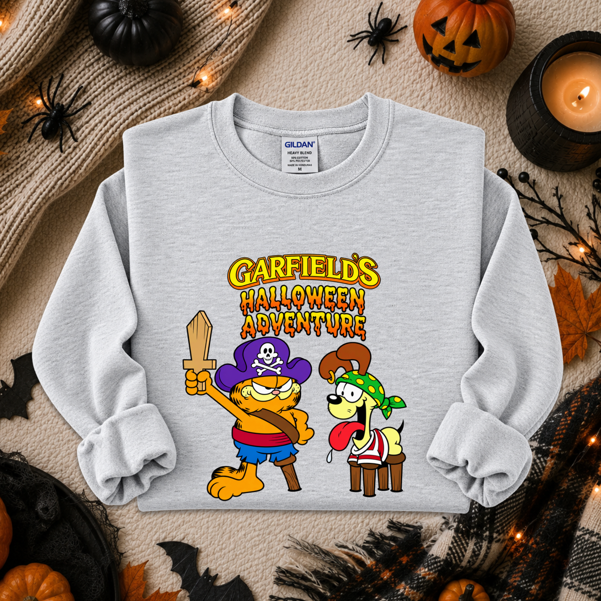 gray sweatshirt with graphic of garfields halloween adventure on it