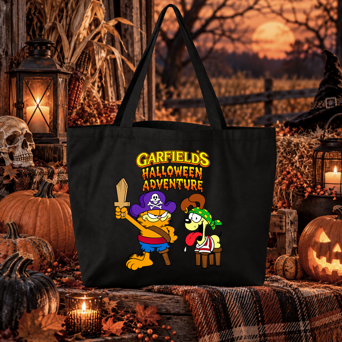 black canvas tote bag with a graphic of garfield in a halloween pirate costume that says garfields halloween adventure