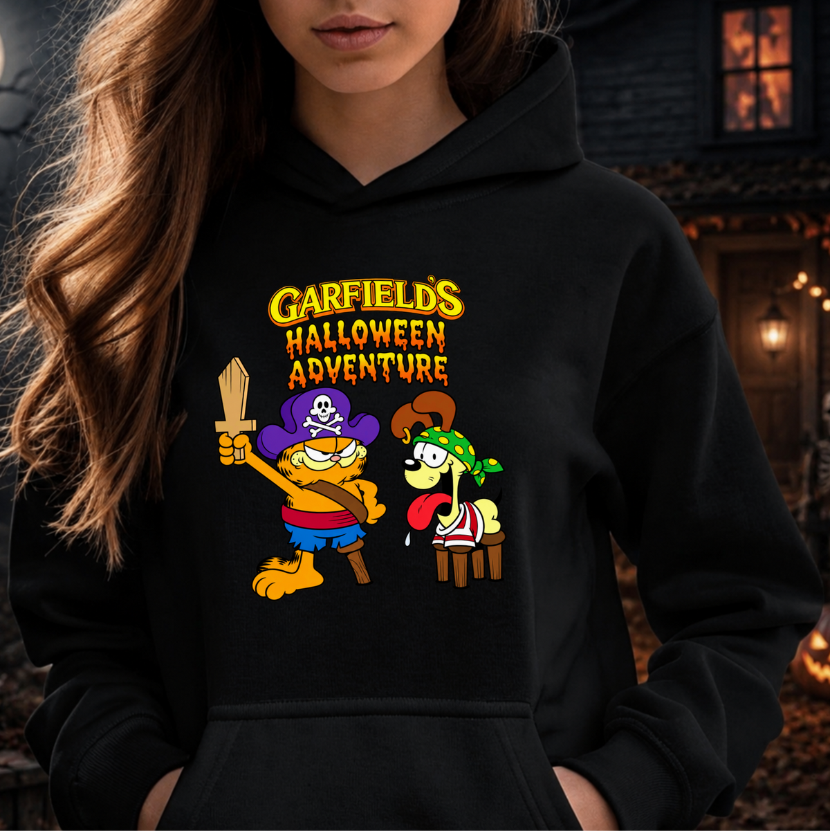 black hooded sweatshirt with graphic of garfields halloween adventure on it