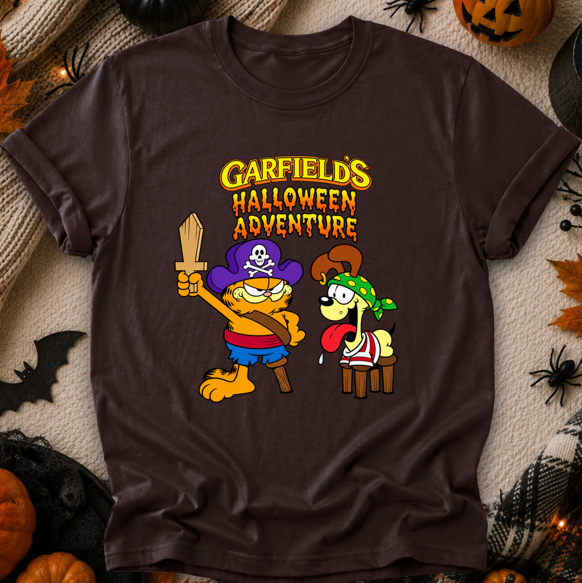 brown tshirt with graphic of garfields halloween adventure on it