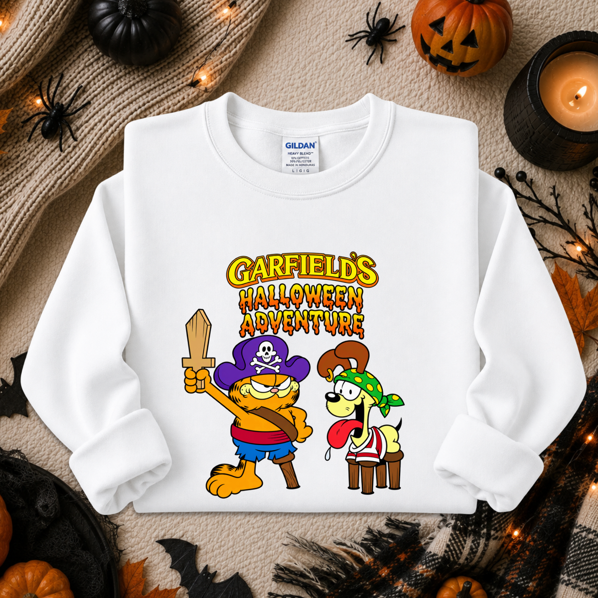 white sweatshirt with graphic of garfields halloween adventure on it