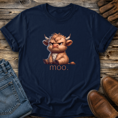 Navy blue t-shirt with a cartoon cow and 'moo.' text on a wooden surface with jeans and boots.