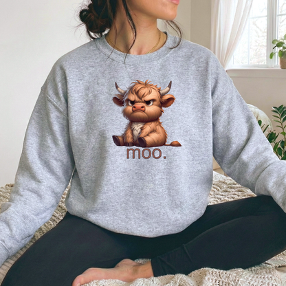 Person wearing a gray sweatshirt with a cartoon bull and 'moo.' text