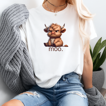 Person wearing a white t-shirt with a cartoon bull and 'moo' text, sitting in a casual setting.