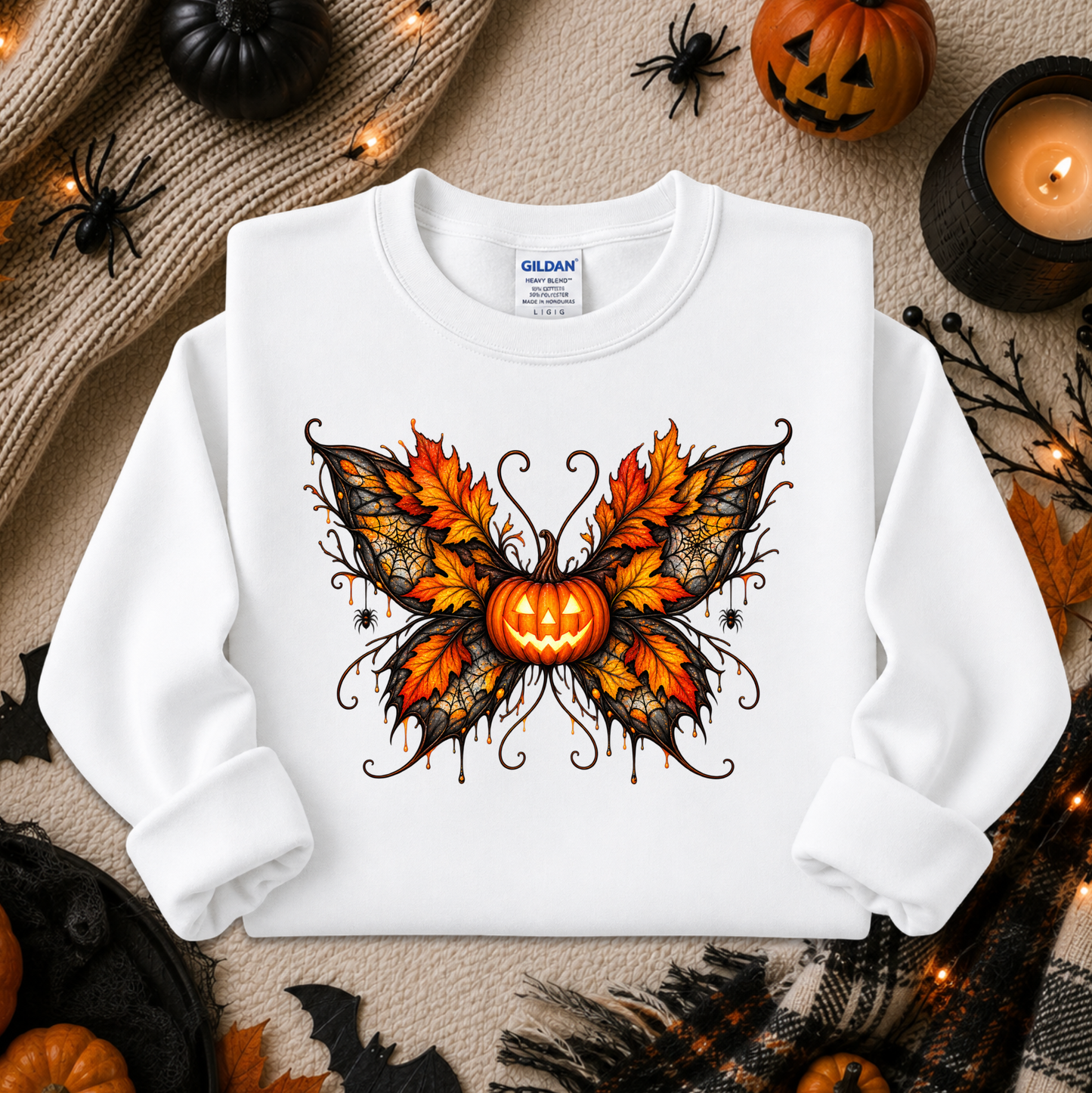 white sweatshirt with a fall autumn halloween pumpkin theme graphic on it