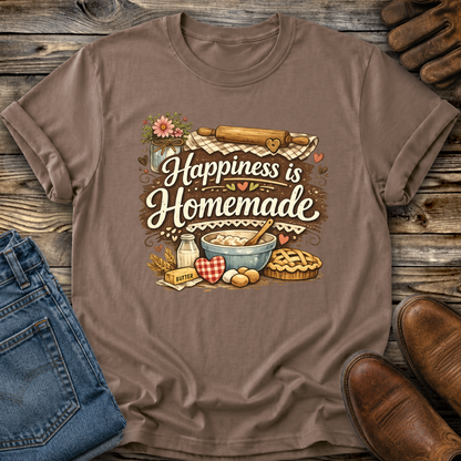 brown tshirt with a baking graphic design that says happiness is homemade on it