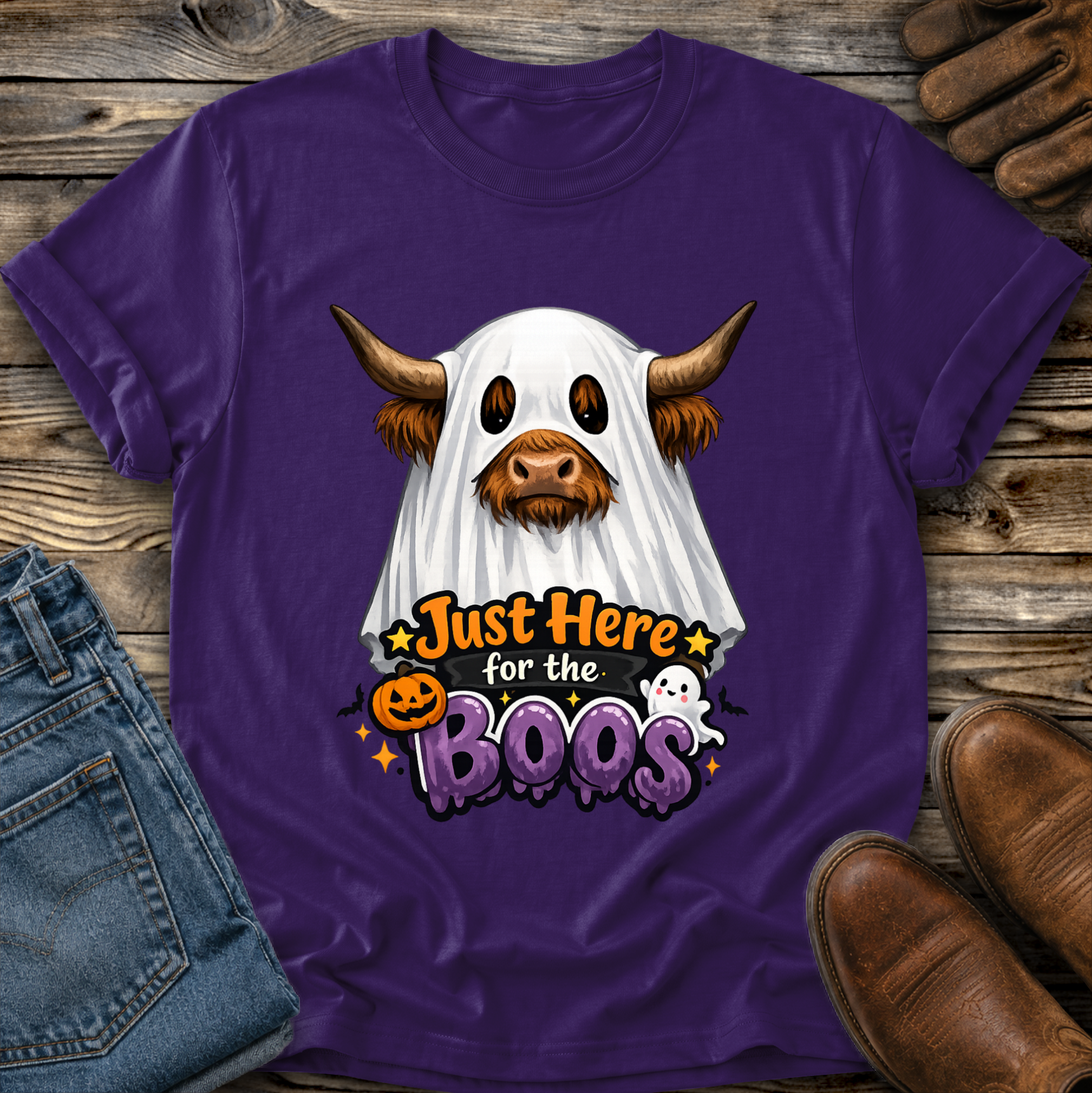 purple tshirt with a highland cow wearing a halloween ghost costume and says just here for the boos