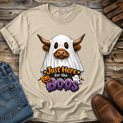 beige tshirt with a highland cow wearing a halloween ghost costume and says just here for the boos
