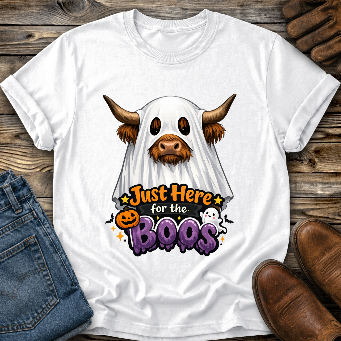 white tshirt with a highland cow wearing a halloween ghost costume and says just here for the boos