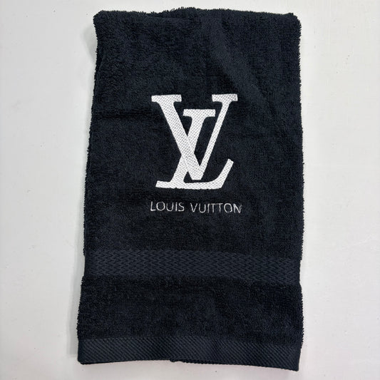 Black towel with Louis Vuitton logo on a white background
