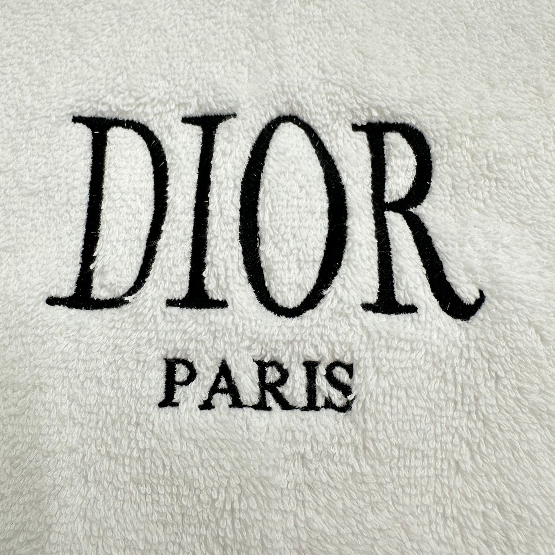 Dior logo on a textured white background