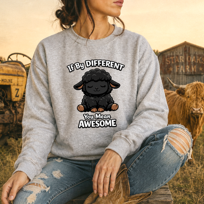 woman wearing a gray sweatshirt with a black sheep graphic that says if by different you mean awesome on it