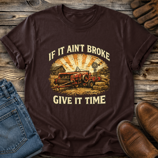 brown tshirt with farm machinery graphic that says if it aint broke give it time
