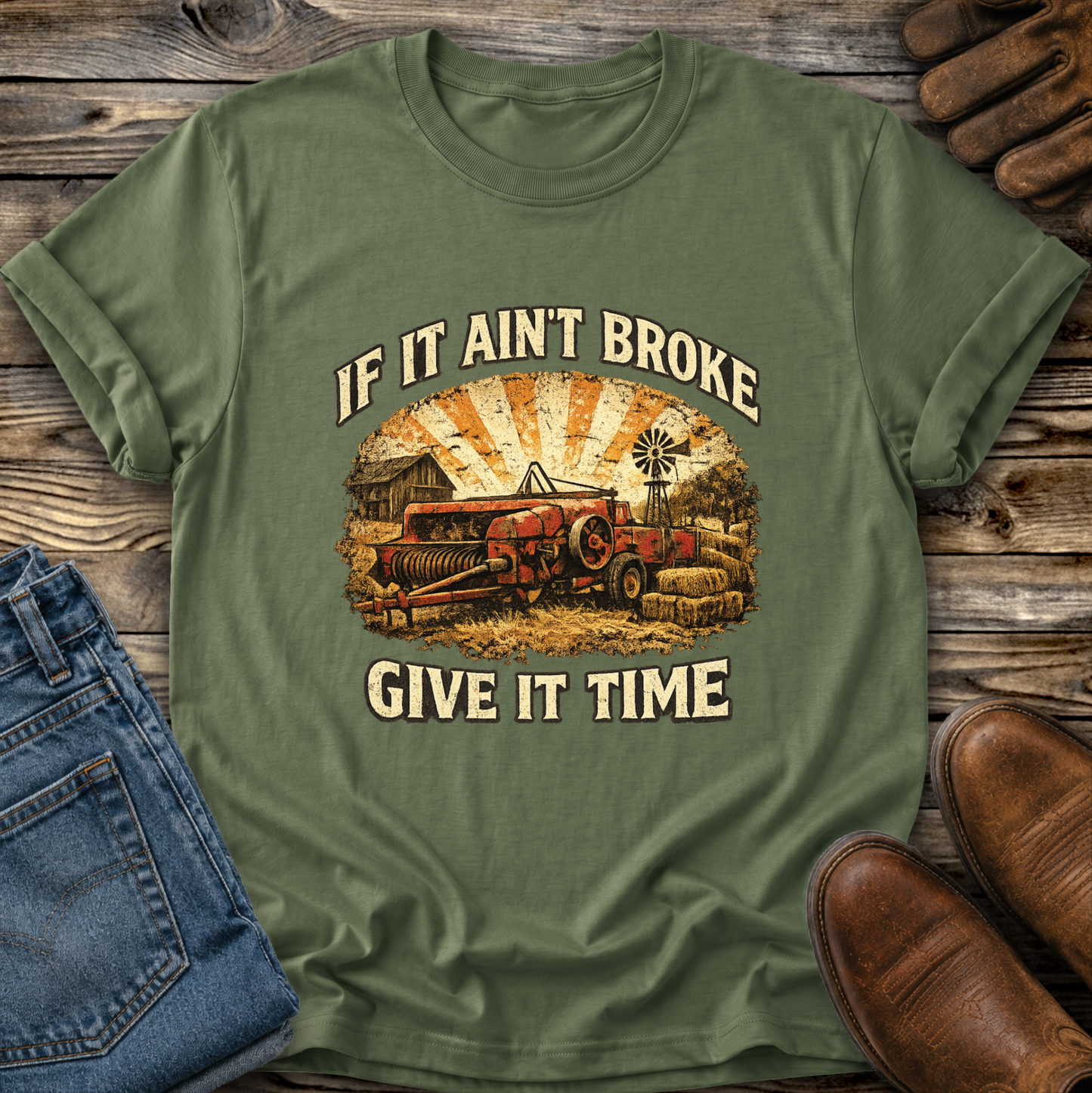 green tshirt with farm machinery graphic that says if it aint broke give it time