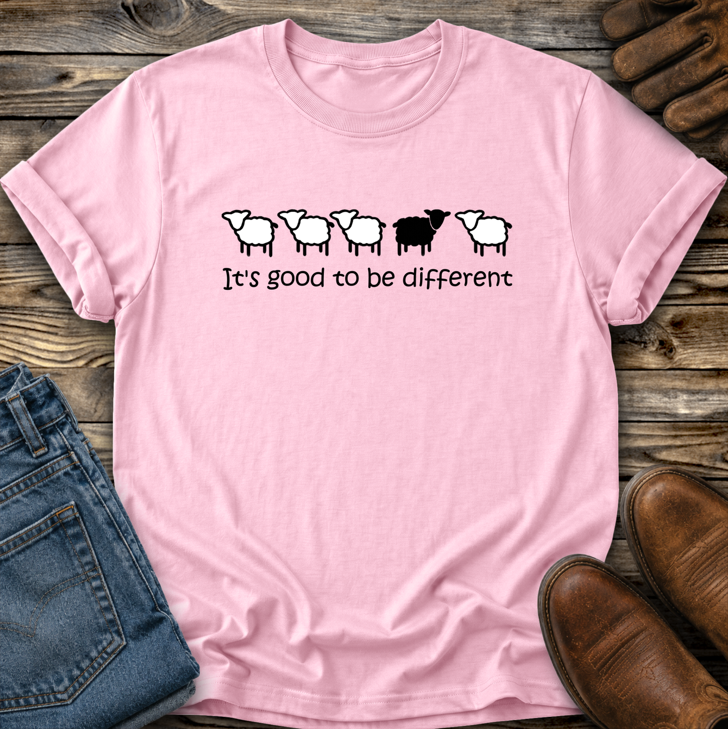 pink tshirt with black sheep that says its good to be different