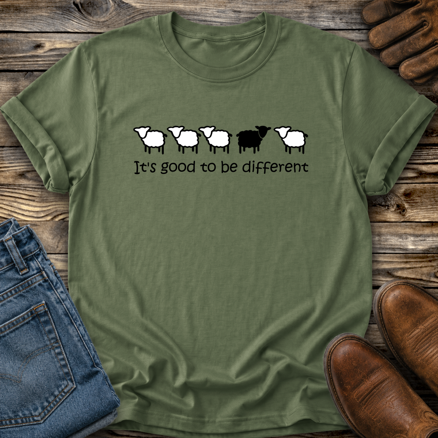 green tshirt with black sheep that says its good to be different