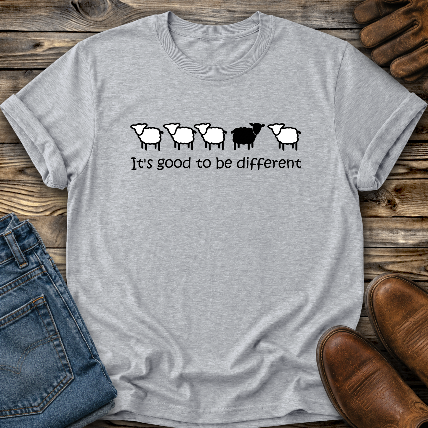gray tshirt with black sheep that says its good to be different
