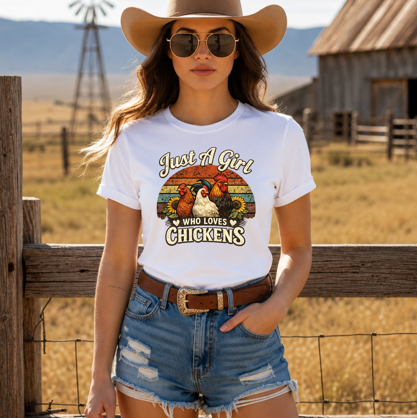woman wearing a white tshirt with a retro sunset and chickens with sunflowers that says just a girl who loves chickens