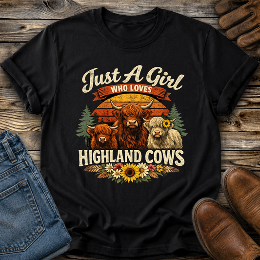 black tshirt with highland cows and flowers graphic that says just a girl who loves highland cows