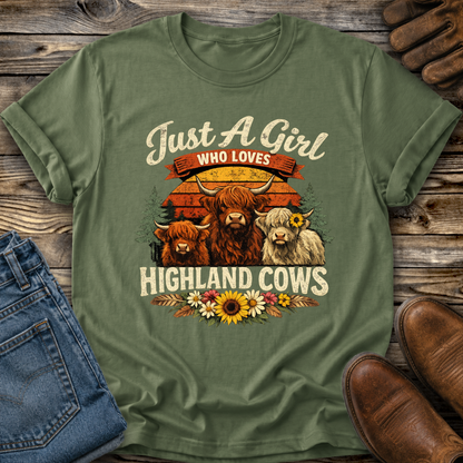 green tshirt with highland cows and flowers graphic that says just a girl who loves highland cows