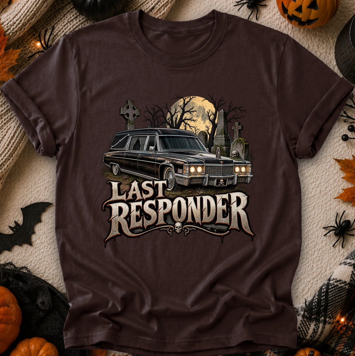brown tshirt with a graphic design of a cemetery and hearse and it says Last Responder