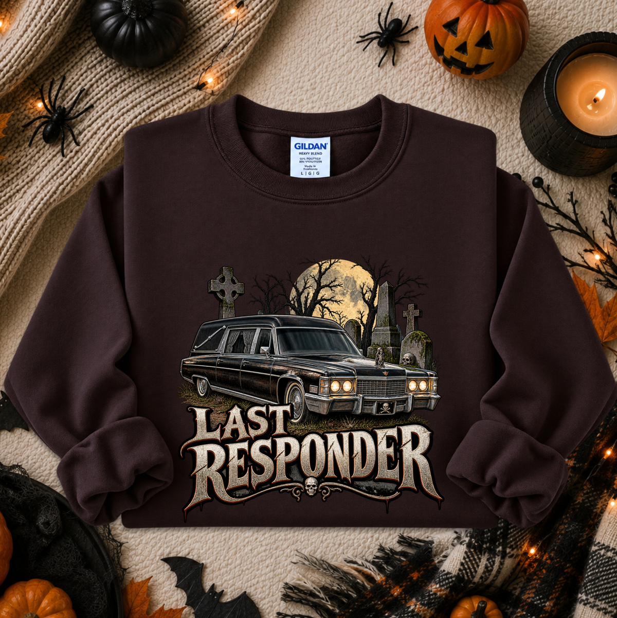 brown sweatshirt with a graphic design of a cemetery and hearse and it says Last Responder