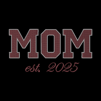 Embroidered-style text reading “MOM est. 2025” in maroon letters with a light outline on a black background.