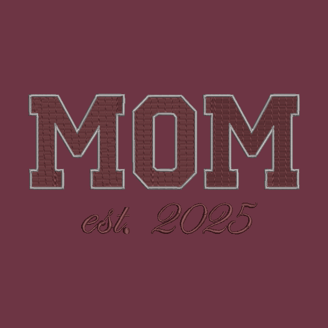 Embroidered collegiate-style 'MOM' lettering in maroon with a light gray outline, above the script text 'est. 2025' on a matching maroon background.