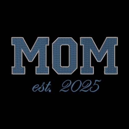 Embroidered text reading 'MOM est. 2025' in blue varsity-style lettering on a black background.