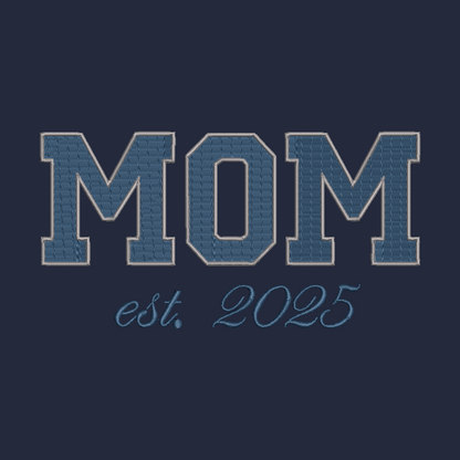 A dark navy blue graphic design featuring the word 'MOM' in large, textured varsity-style block letters outlined in light blue, with 'est. 2025' written below in a matching light blue script font.