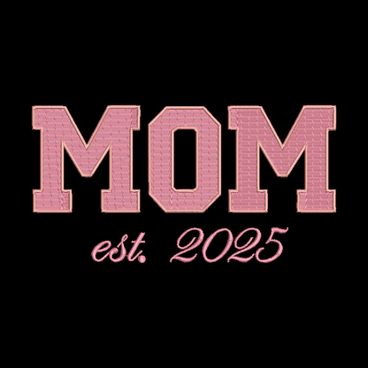 Pink embroidered-style text reading 'MOM est. 2025' on a solid black background.